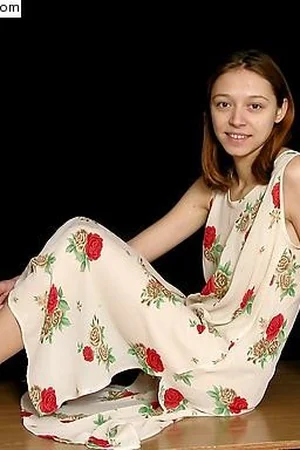 Girl in Floral Dress Lifts Skirt — photo 1