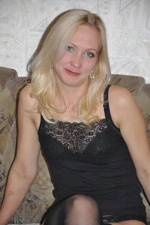 Blonde in Stockings Flashes Small Tits and Slender Figure for Camera