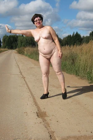 Mature Lady Strips and Strolls Nude Outdoors — photo 24