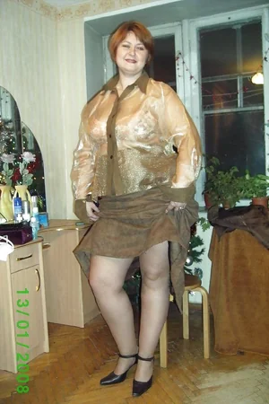 Plump Lady Undresses by Christmas Tree — photo 2