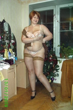 Plump Lady Undresses by Christmas Tree — photo 5