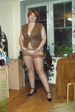Plump Lady Undresses by Christmas Tree — photo 6