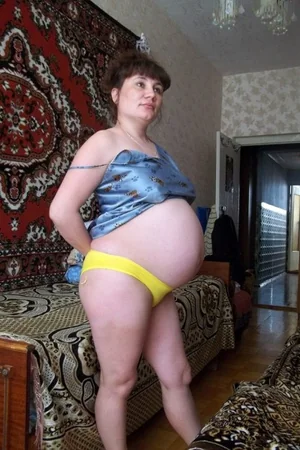 Pregnant Woman Undresses — photo 2