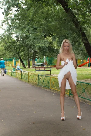 Skinny Blonde Flashes Pussy Outdoors — photo 17